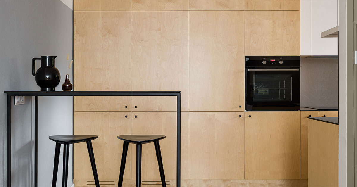 Kitchen with plywood cupboards, panorama