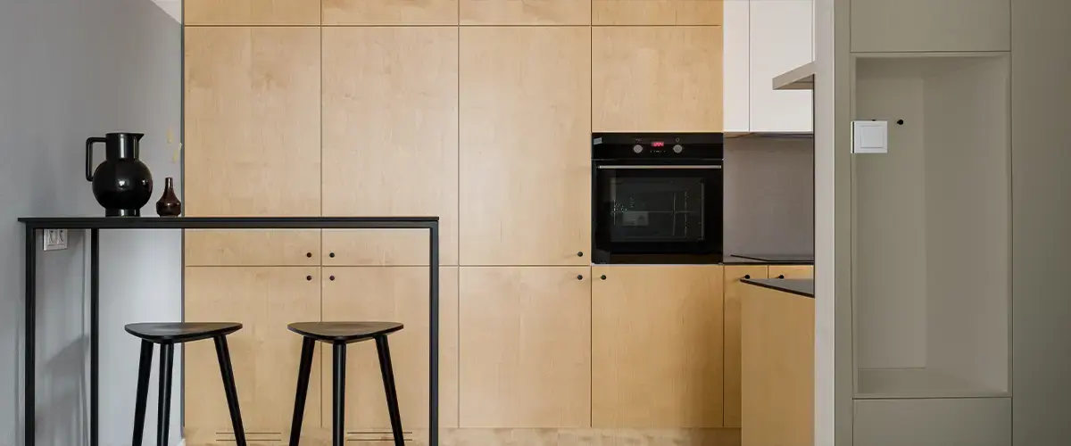 Kitchen with plywood cupboards, panorama