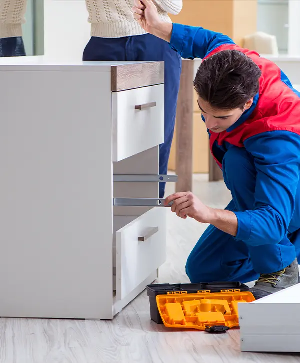 Contractor in the process of cabinet assembly in montreux