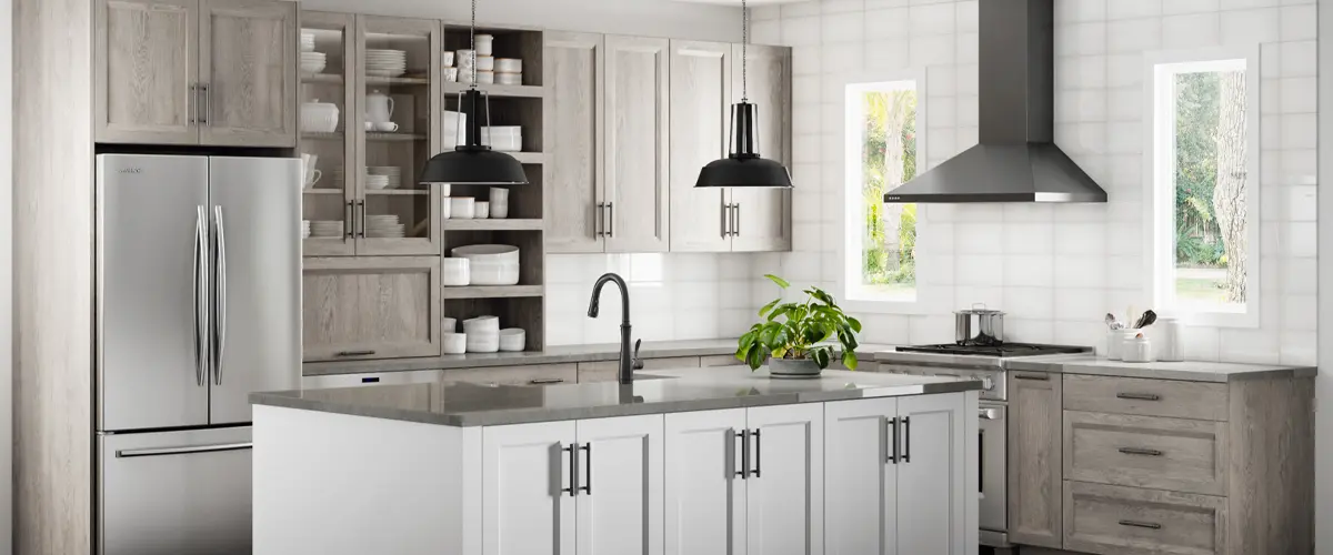 Contemporary kitchen design with light wood cabinets, white island, black fixtures, and stainless steel appliances