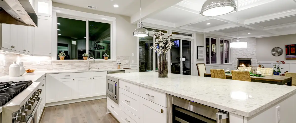 Modern open-concept kitchen with large island and pendant lights