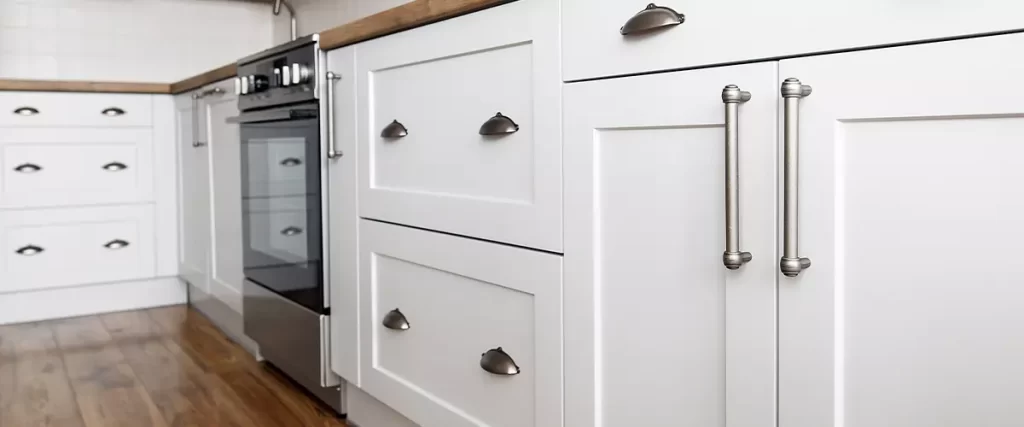 White shaker cabinets with stainless steel handles