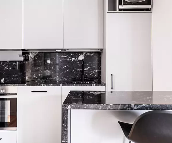 full white kitchen, white kitchen cabinets with black marble countertop